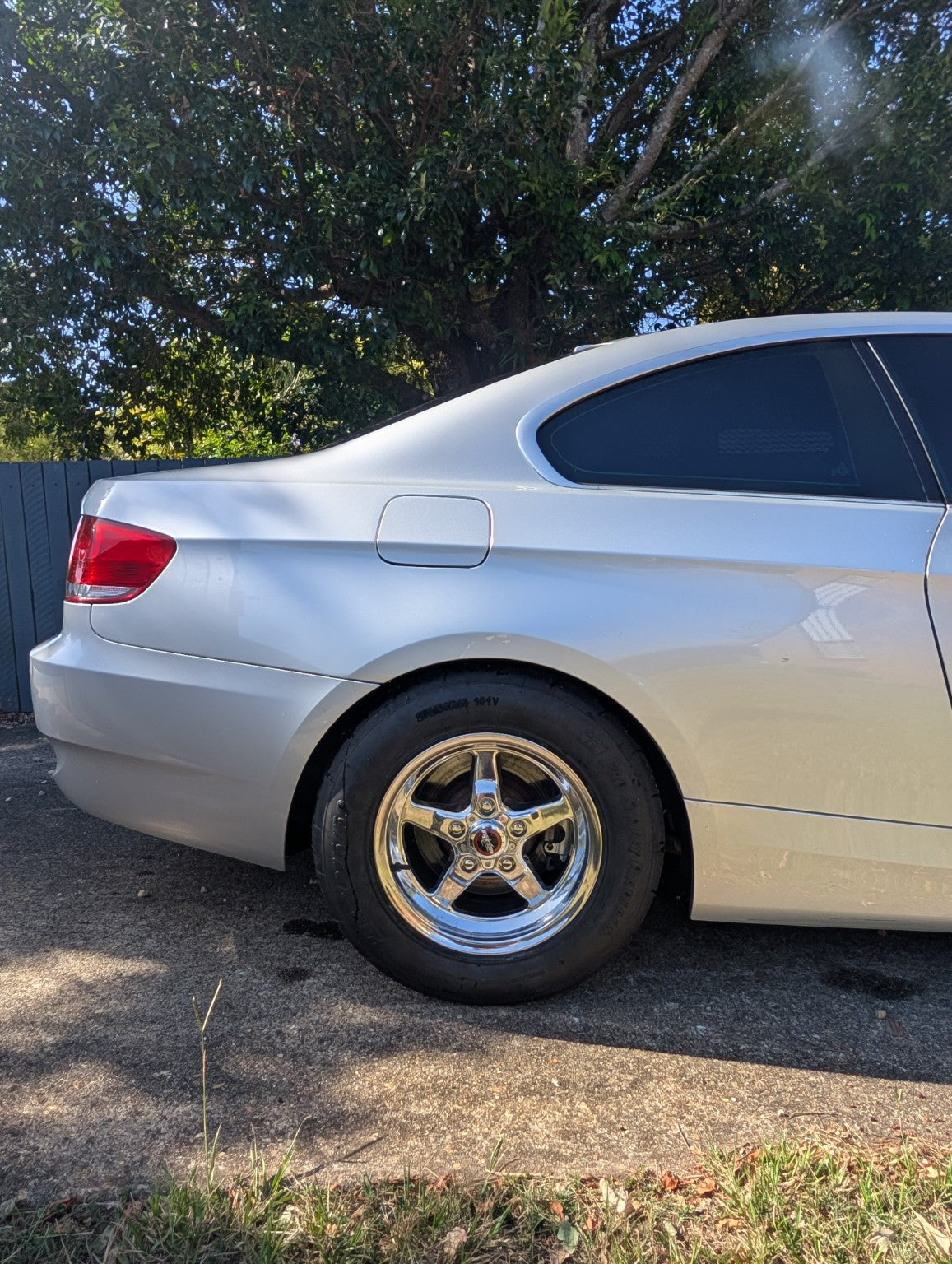 Rear wheel and tyre detail on a silver BMW E92 showing a drag-wheel setup